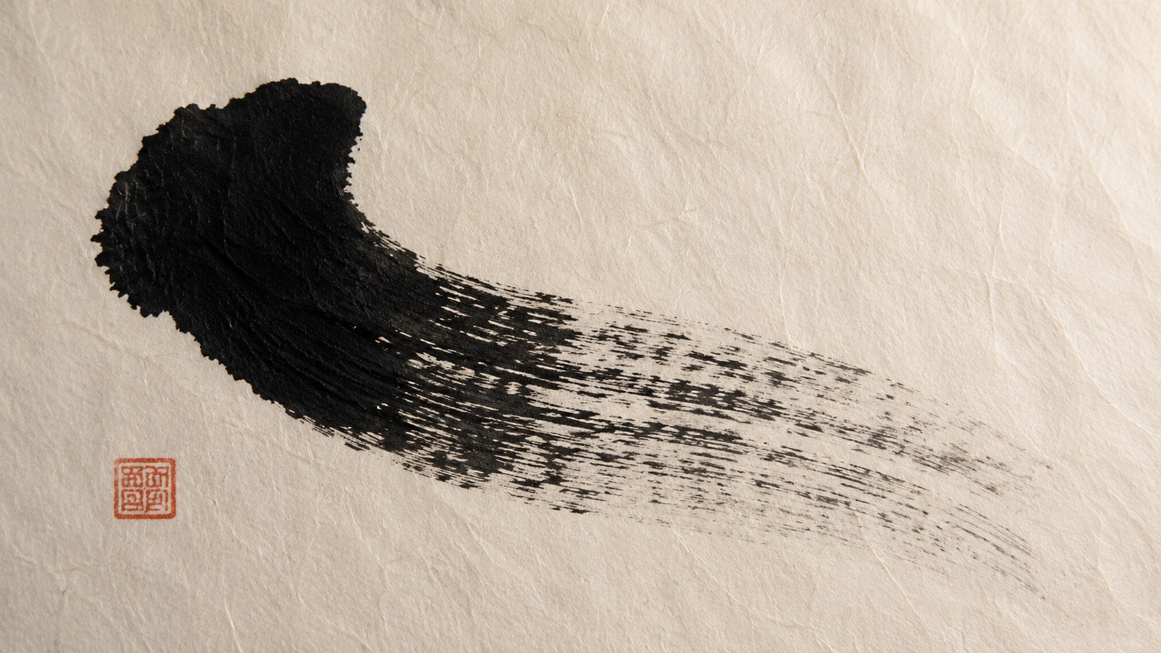 A close-up of a single bold Japanese calligraphy brushstroke on cream washi paper showing the kasure dry-brush effect, where the black ink breaks into scratchy grey streaks as the brush runs out — imperfection prized as beauty.